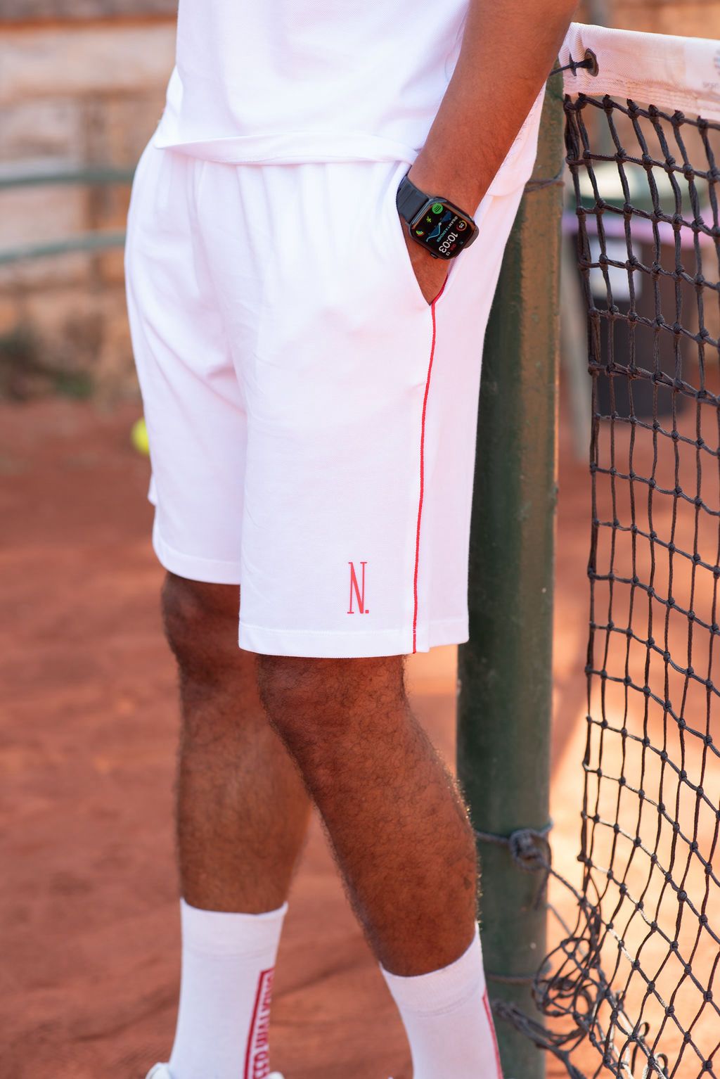 White tennis shorts with red side-seam piping, Nordi Activewear